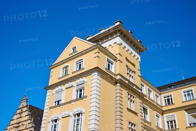 Historic building with yellow façade and decorative elements, Regensburg, Bavaria, Germany