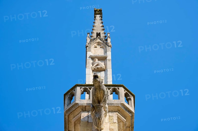 Detail of a Gothic spire with sculptures in the blue sky, St Peter's Cathedral, Regensburg, Bavaria, Germany