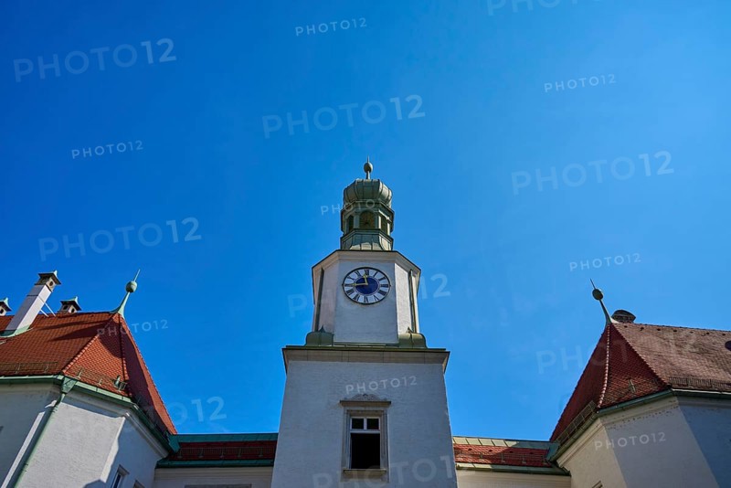 Tower with clock on a historic building. Blue roof and baroque details against a clear sky, brewhouse am Schloss, Regensburg, Bavaria, Germany
