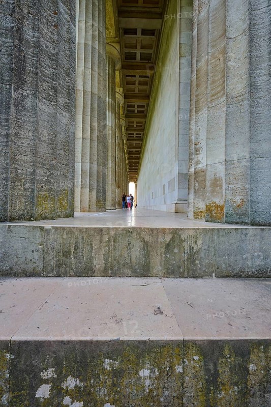 Long colonnade with people in the background, emphasised by a vanishing point, Walhalla, Donaustauf, Regensburg, Bavaria, Germany