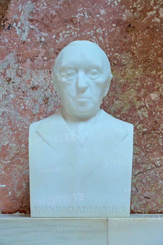 Serious marble bust of Konrad Adenauer, white marble against a red background, Walhalla, Donaustauf, Regensburg, Bavaria, Germany