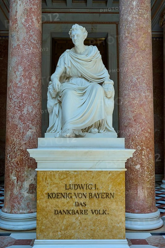 Marble statuette of Ludwig I in a sitting pose between red columns, Walhalla, Donaustauf, Regensburg, Bavaria, Germany