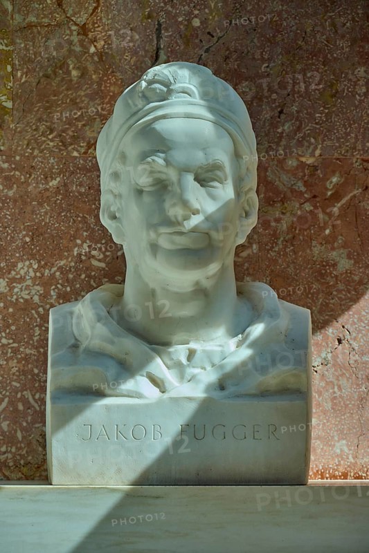 White marble bust of Jakob Fugger in front of a reddish wall, Walhalla, Donaustauf, Regensburg, Bavaria, Germany