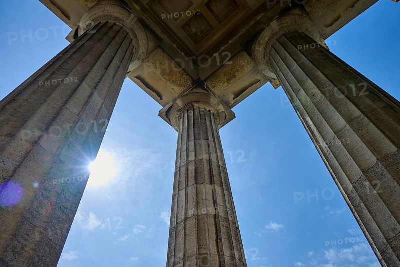 Majestic columns under a bright blue sky, seen from a low perspective, Walhalla, Donaustauf, Regensburg, Bavaria, Germany
