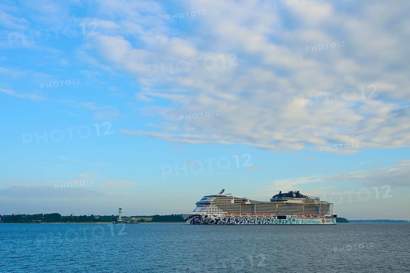 A cruise ship, MSC Euribia, moves through wide waters under a cloudy sky, Heikendorf, Plön district, Kiel Fjord, Schleswig-Holstein, Germany