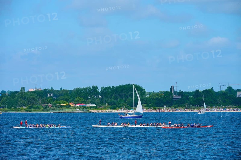 Canoeist and sailing boat on the sea in sunny weather, Heikendorf, Plön district, Kiel Fjord, Schleswig-Holstein, Germany