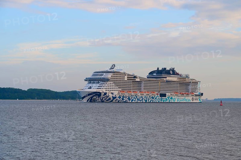 A cruise ship, MSC Euribia, sailing close to the coast across the calm sea, Heikendorf, Plön district, Kiel Fjord, Schleswig-Holstein, Germany