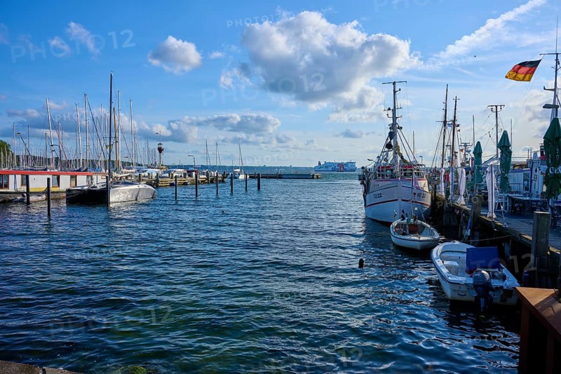 Harbour view with moored boats and blowing wind under a blue sky, Heikendorf, Plön district, Kiel Fjord, Schleswig-Holstein, Germany