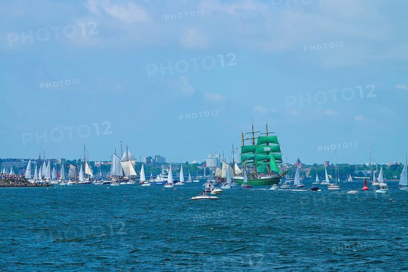 Green tall ship Alexander von Humbold 2 surrounded by many boats in front of an urban backdrop, Windjammer Parade Kiel 2025, Heikendorf, Plön district, Kiel Fjord, Schleswig-Holstein, Germany