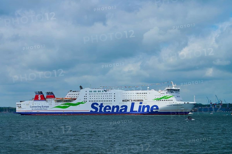 Stena Line ferry sails calmly across the sea under a dramatic, cloudy sky, Windjammer Parade Kiel 2025, Heikendorf, Plön district, Kiel Fjord, Schleswig-Holstein, Germany