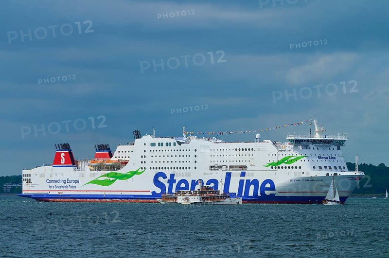 Large Stena Line ferry on the sea, accompanied by smaller sailing boats under a cloudy sky, Windjammer Parade Kiel 2025, Heikendorf, Plön district, Kiel Fjord, Schleswig-Holstein, Germany