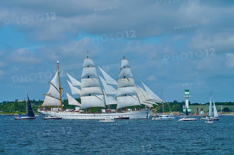 Large sailing ship Gorch Fock with several white sails on the sea under a blue sky, Windjammer Parade Kiel 2025, lighthouse Friedrichsort, district Plön, Kieler Förde, Schleswig-Holstein, Germany