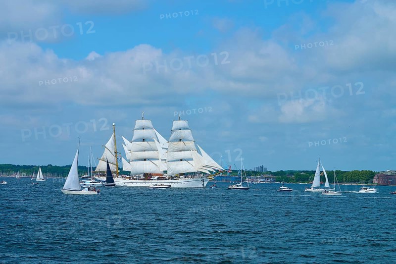 A large sailing ship Gorch Fock surrounded by smaller boats on the water, Windjammer Parade Kiel 2025, Heikendorf, Plön district, Kiel Fjord, Schleswig-Holstein, Germany