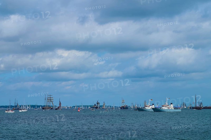 Yachts and sailing ships join each other on the sea under a cloudy sky, Windjammer Parade Kiel 2025, Heikendorf, Kreis Plön, Kieler Förde, Schleswig-Holstein, Germany