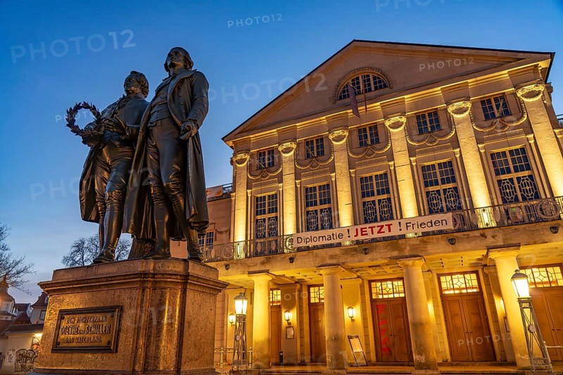 The German National Theatre with the Goethe and Schiller Monument at dusk, Weimar, Thuringia, Germany