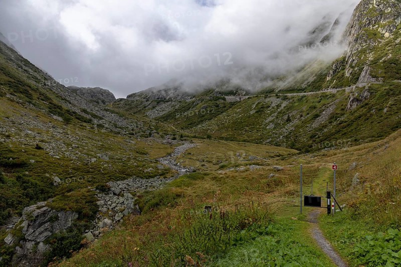 Fog, hiking trail at the Gotthard Pass, right pass road, Hospental, Uri, Switzerland