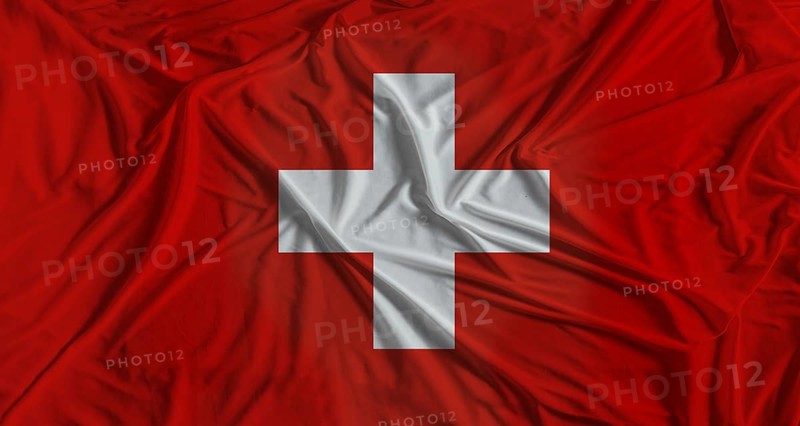 Swiss flag with fabric texture background. National flag of Switzerland