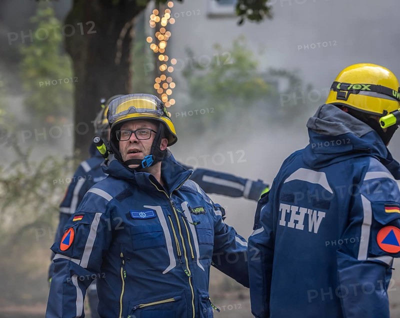 Civil defence exercise scenario, after a drone attack on a residential area, emergency services clear the area, at the large-scale exercise FÜLEX25, of the THW, Technisches Hilfswerk, Landesverband North Rhine-Westphalia, on 4 weekends over 3500 volunteers from the 127 North Rhine-Westphalia local associations practice many different deployment scenarios, from the field of disaster control and civil defence