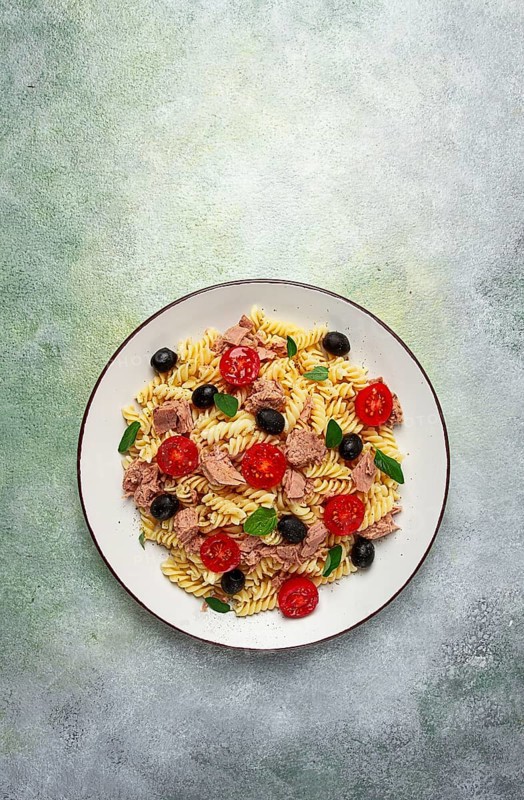 Tuna salad, fusilli pasta, olives and cherry, olive oil, homemade