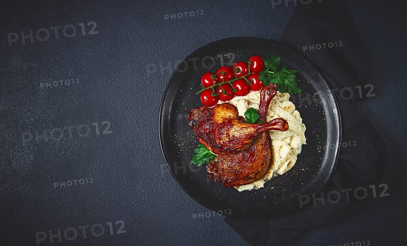 Fried duck shank, cauliflower puree, cherry tomatoes, homemade, no people