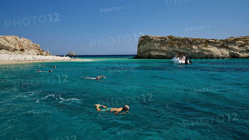 People swimming in the open sea, a boat approaches the rocks, White Cliffs, White Beach, Makri Aspronisi Island, Natura 2000 area, boat trip, Aspronisi, Lipsi, Dodecanese, Greek Islands, Greece