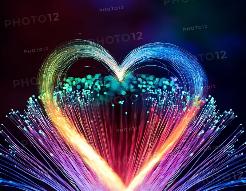 Colorful artistic display featuring vibrant light patterns shaped like a heart, expressing love and creativity through illuminated fibers in a mesmerizing spectrum of rainbow hues, AI generated