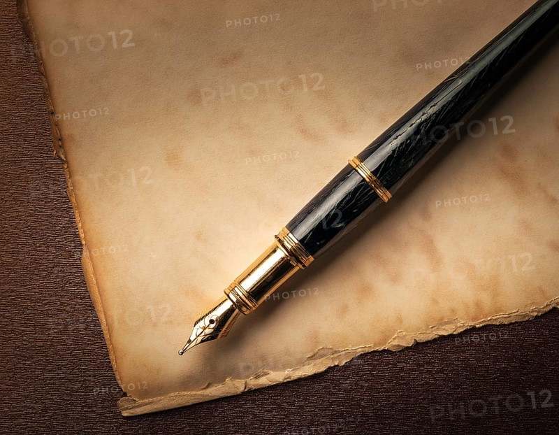 Close-up of a classic fountain pen lying atop old aged paper on a wooden surface, symbolizing timeless writing, creativity, and tradition, AI generated