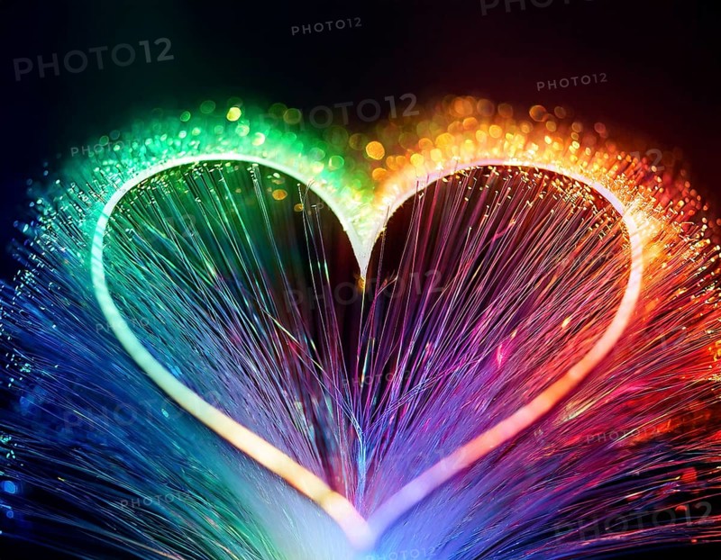 Colorful artistic display featuring vibrant light patterns shaped like a heart, expressing love and creativity through illuminated fibers in a mesmerizing spectrum of rainbow hues, AI generated
