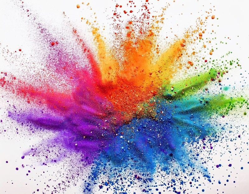 Vibrant and energetic multicolored powder explosion captured against awhite background. Evoking festival celebrations reminiscent of Holi, with dynamic motion and graphic potential for creative artistic projects, AI generated