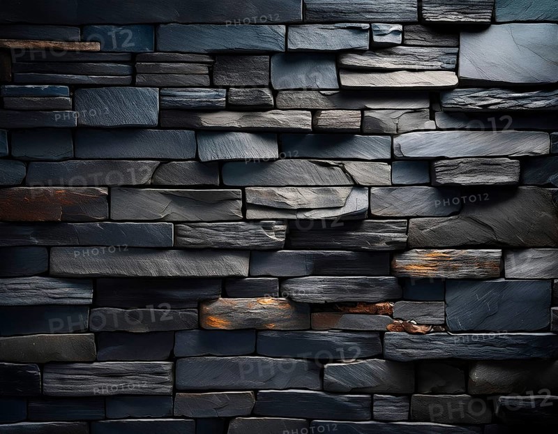 Rugged dark stone bricks arranged in a detailed pattern, showcasing texture and subtle highlights, perfect as a background or design element for natural, architectural, or rustic aesthetic projects, AI generated