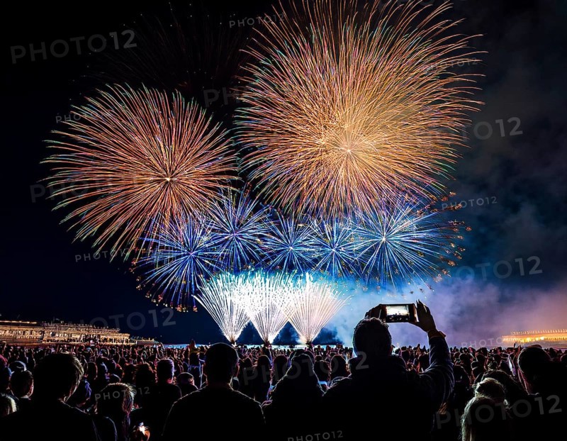 Thrilling fireworks illuminate the dark sky as a crowd gathers to enjoy the dazzling display, creating an atmosphere of festivity and wonder, AI generated