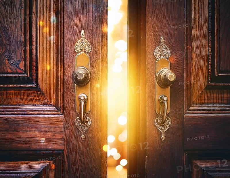 Vintage door ajar in the middle with glowing magical warm lights on the other side, AI generated