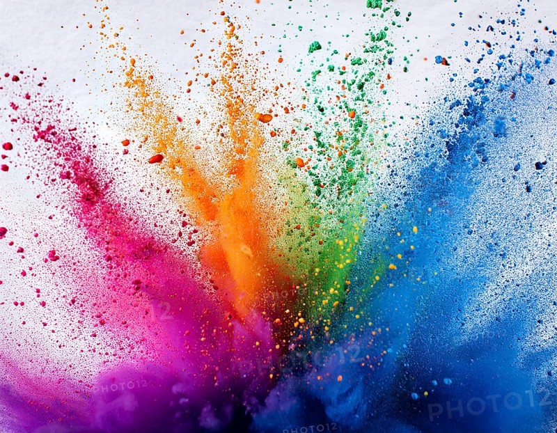 Vibrant and energetic multicolored powder explosion captured against awhite background. Evoking festival celebrations reminiscent of Holi, with dynamic motion and graphic potential for creative artistic projects, AI generated