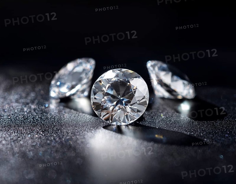 A brilliant collection of diamonds illuminated with striking lighting effects, emphasizing their clarity and sparkle, perfect for themes of luxury, wealth, and elegance, AI generated