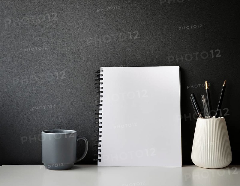 A clean, organized workspace featuring decorative objects, a white blank canvas, greenery, and essentials like notebooks and pencils. Ideal for showcasing creativity, design, or minimalist modern interiors, AI generated