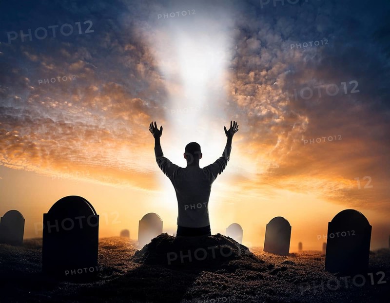 A silhouette of a lone figure walking off a gravestone, The scene evokes Resurrection thoughts emotional depth, AI generated