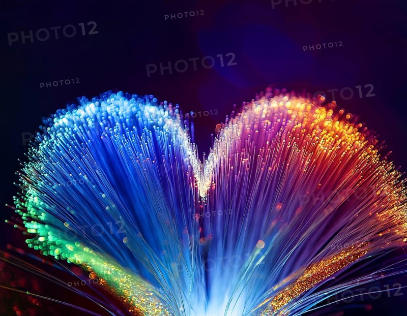 Colorful artistic display featuring vibrant light patterns shaped like a heart, expressing love and creativity through illuminated fibers in a mesmerizing spectrum of rainbow hues, AI generated