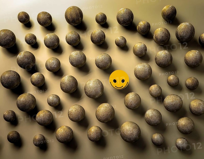Wooden balls feature faces, one smiling among sad expressions, representing positivity or individuality, AI generated