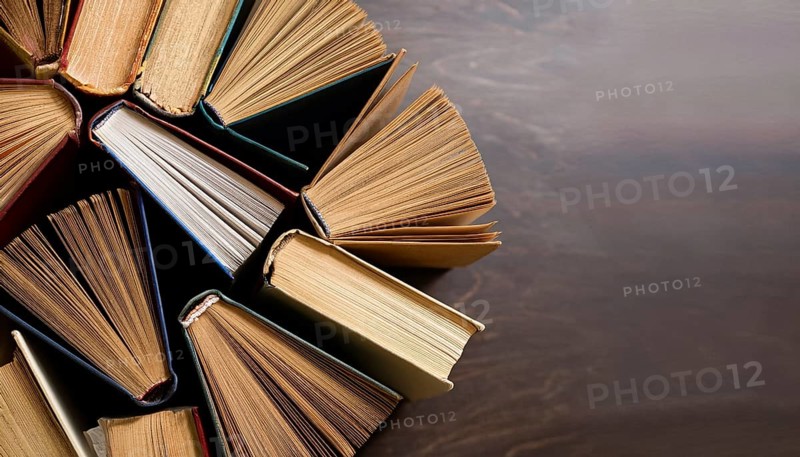 Old books arranged highlighting their historical significance. Neatly arranged representing a collection of wisdom, AI generated