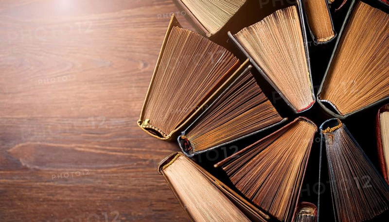 Old books arranged highlighting their historical significance. Neatly arranged representing a collection of wisdom, AI generated