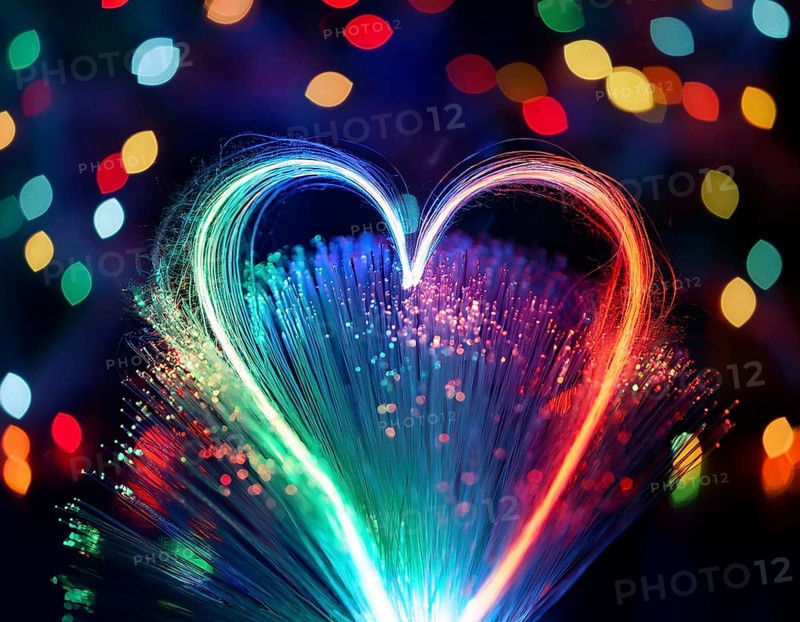 Colorful artistic display featuring vibrant light patterns shaped like a heart, expressing love and creativity through illuminated fibers in a mesmerizing spectrum of rainbow hues, AI generated