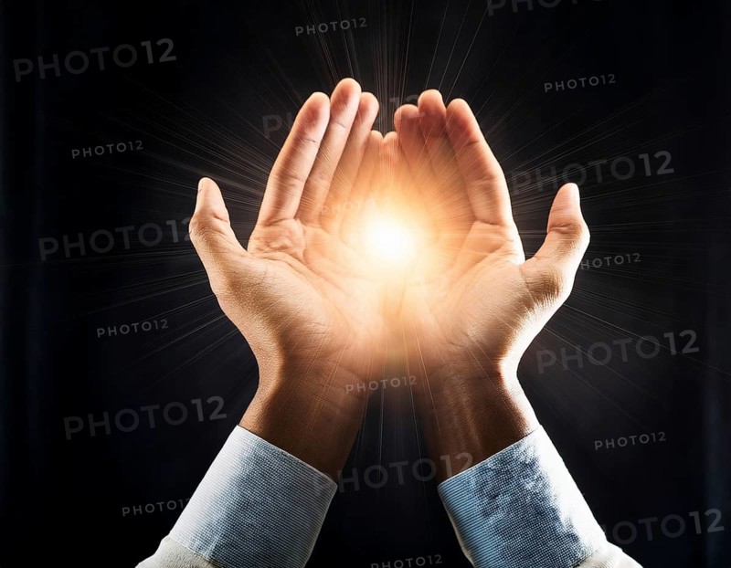 Hand holding light ray in the darkness, hope concept. Light in hands. Freedom and spirituality concept, AI generated
