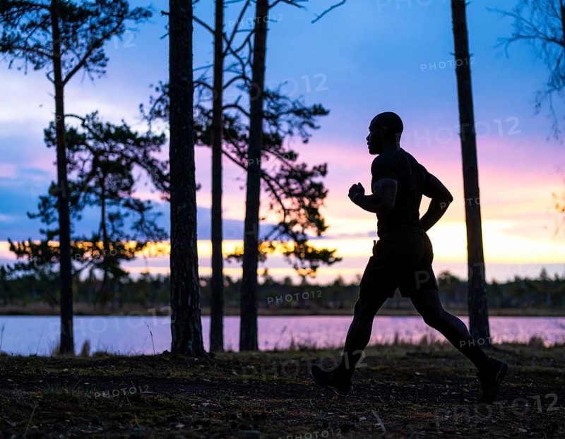 A cinematic silhouette of an athletic man running, representing fitness, endurance, wellness, and healthy active living, AI generated