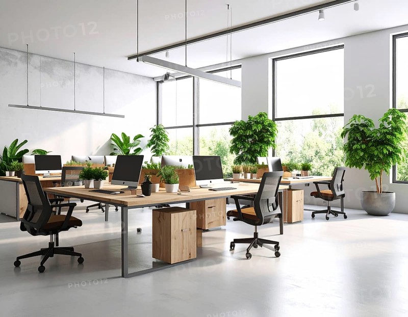 Modern coworking space with laptops, coffee cups, plants, and daylight showcasing minimal interior design and productivity, AI generated