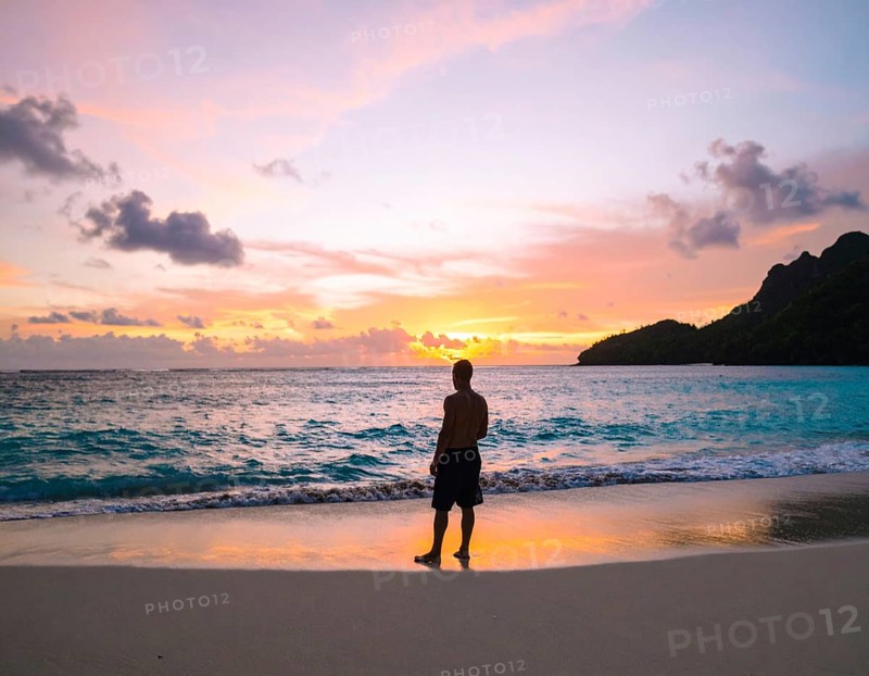Man on the beach art poster, distant silhouette print symbolizing reflection, solitude, and harmony with nature, AI generated