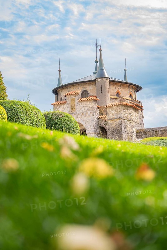 Beautiful castle with pewter towers and manicured lawns under a blue sky, Lichtenstein Castle, Lichtenstein, Swabian Alb, Germany