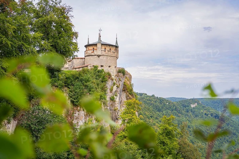 An impressive castle perched high on a cliff with sweeping views over the green landscape, Lichtenstein Castle, Lichtenstein, Swabian Alb, Germany