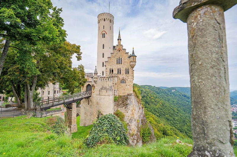 Castle majestically enthroned on a cliff, surrounded by green forest, Lichtenstein Castle, Lichtenstein, Swabian Alb, Germany