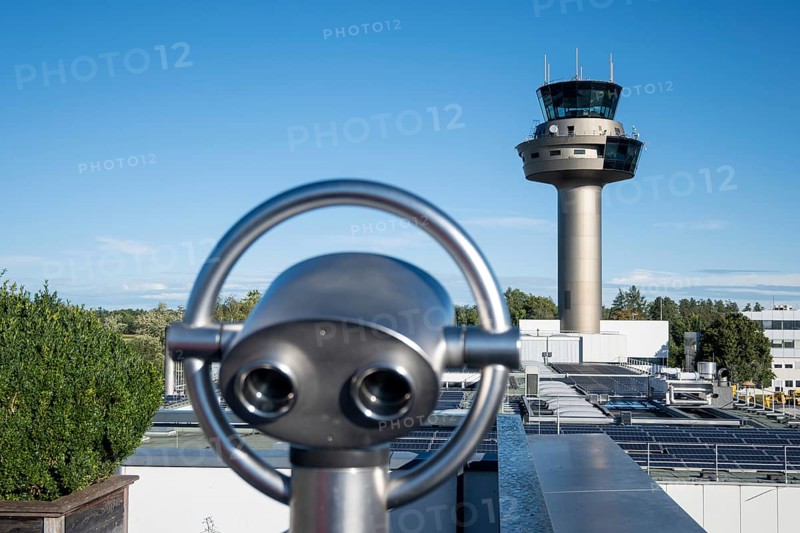 Binoculars for visitors aimed at the tower of Salzburg Airport, Austria