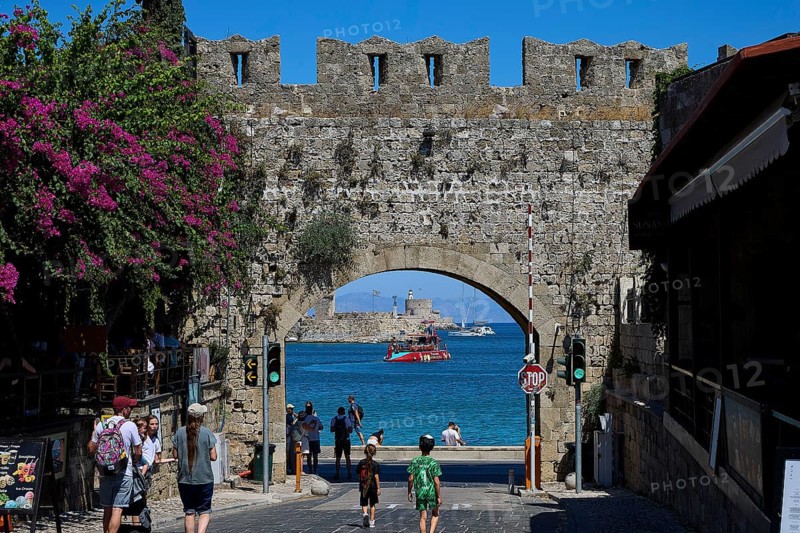 Panagia Tor, natural stone archway with a view of the sea and passing tourists, Rhodes Old Town, Rhodes Town, Rhodes, Dodecanese, Greek Islands, Greece
